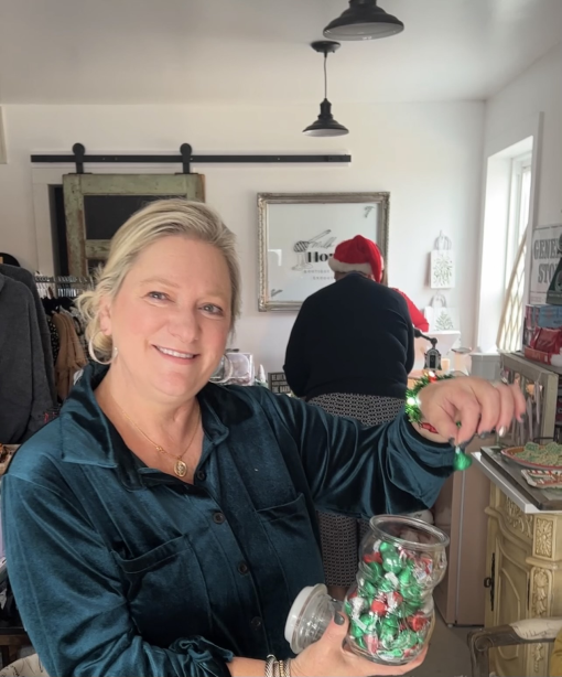 Sonya Groves shows off some candy in her new shop in Coopertown.